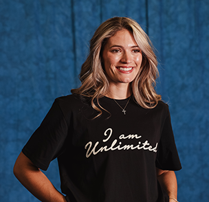 Montana Fouts smiling wearing an I Am Unlimited tee