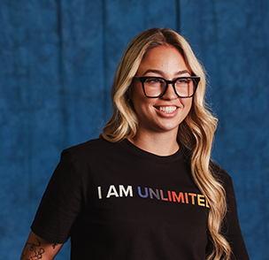 Sam Landry smiling wearing an I am Unlimited tee