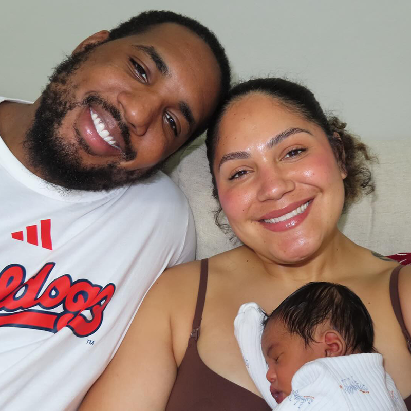 Jocelyn Alo and her husband Bobby Evans, with their son.