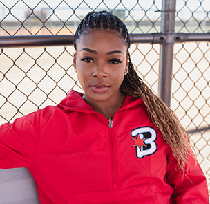 Odicci Alexander in a red Bandits zip up