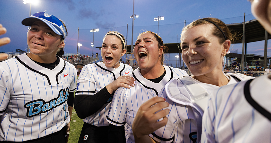 Cori McMillan, Devyn Netz, Taylor McQuillin, and Delanie Wisz celebrating the Bandits victory