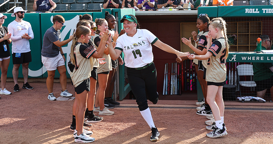 Hannah Flippen in white Utah Talons jersey runs through the fans high five line