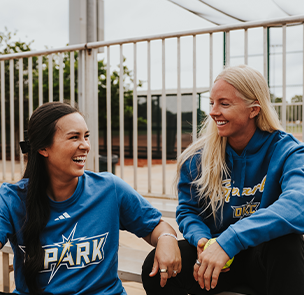 Bubba Nickles-Camarena and Sydney Sherrill in OKC Spark merch.