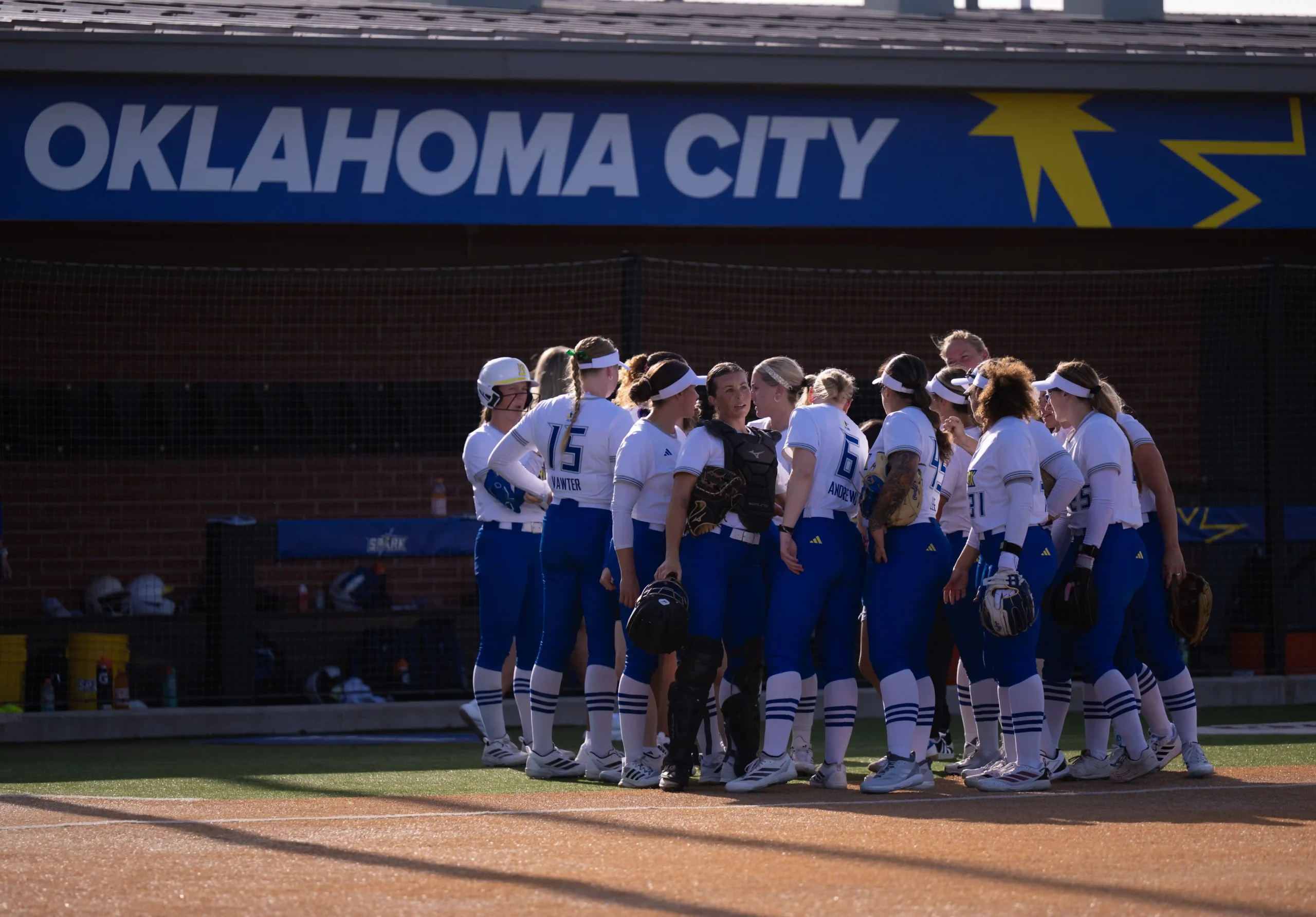 Oklahoma City Spark 2026 professional softball team in a huddle in Oklahoma City, OK