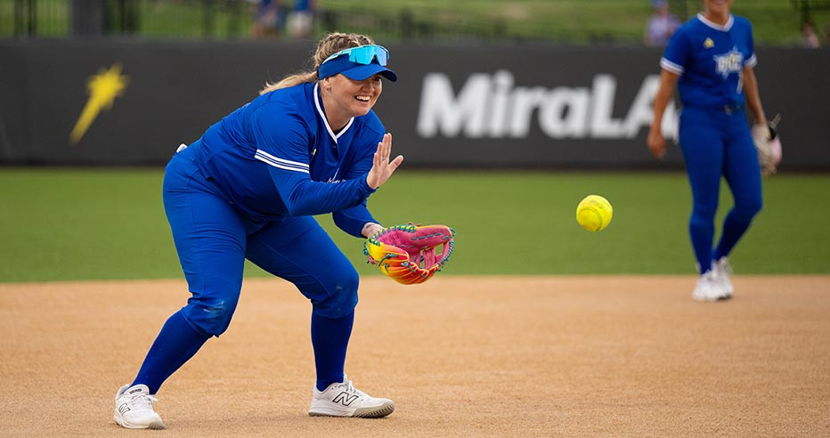 Jessi Warren smiles as she fields a ball for the OKC Spark.